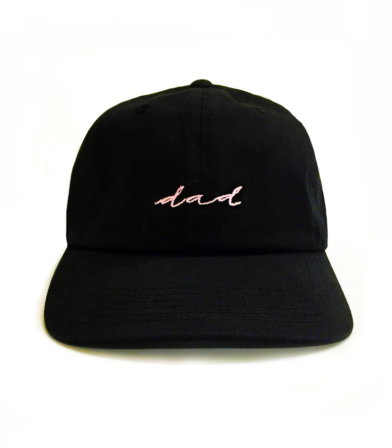 Black cap with 'dad' embroidered on a white background